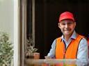 Courier handing a parcel to happy recipient